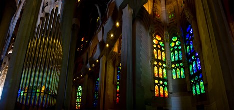 stained glass windows and organ pipes in the Sagrada Familia in Barcelona