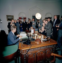 18 October 1962
Proclamation signing, Interdiction of the Delivery of Offensive Weapons to Cuba, 7:05PM
[Scratch down the right side of the image original to negative.]

Please Credit. "Robert Knudsen...