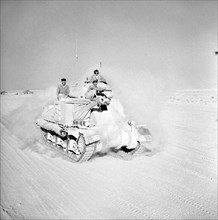 British Grant tank moving up to the front during Second Battle of El Alamein during the WW2 North Africa campaign