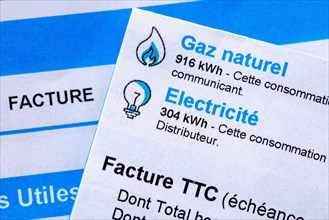 Rise of energy prices in France: close-up of a French invoice with details of the natural gas and electricity consumptions to be paid measured in kWh