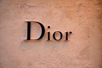 Christian Dior sign signboard on wall of store in Via dei Condotti Rome Italy