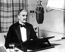 NEVILLE CHAMBERLAIN (1869-1940) as British Prime Minister broadcasting the declaration of war on Germany 3 September 1939