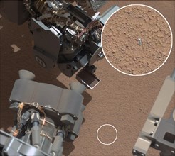 View of Curiosity's First Scoop Also Shows Bright Object This image from the right Mast Camera