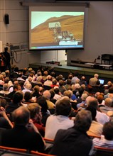Scientists, students and family members follow the broadcasting of the Mars landing of the Curiosits robot, at the University in Kiel, Germany, 06 August 2012. The Curiosity robot is equipped with a n...