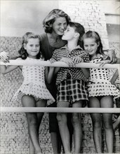 Actress Ingrid Bergman with her three children on a balcony