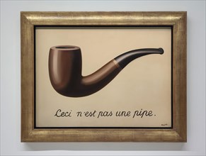 Painting 'La trahison des images' ('The Treachery of Images') by Belgian surrealist artist Rene Magritte (1929) on display at his retrospective exhibition in the Centre Pompidou in Paris, France. The ...