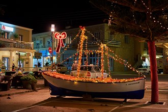 Wooden Christmas ship decorated at night. In the Greek tradition (especially in the islands) it is common to ornament a ship instead of a tree for Chr
