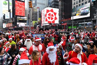 Hundreds of people participate in SantaCon NY, an annual pub crawl in which people dressed in Santa Claus costumes or as other Christmas characters pa