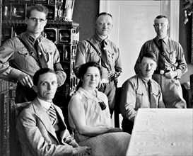 Senior nazi party figures. Standing, left to right: Rudolf Hess, Martin Mutschmann (?), Heinrich Himmler (?). Seated, left to right: Joseph Goebbels, ?, Adolf Hitler.