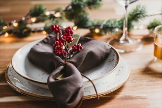 Festive table setting with winter decor. The concept of Thanksgiving or Christmas family dinner.