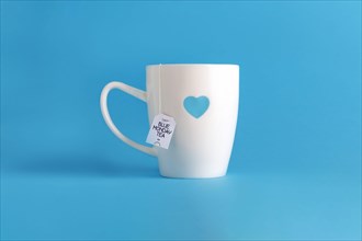 Blue monday tea. White cup on blue.