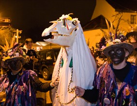 The Welsh Mari Lwyd stands on the bridge to meet the English Wassailers at the Chepstow Wassail and Mari Lwyd custom, Chepstow