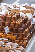 On a street market. Caneles cakes. Bordeaux city, Aquitaine, Gironde, France