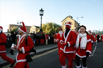 Santacon 2006. Santas in Trafalgar Square in London. Hundreds of pranksters dressed as Santas take over the streets of London