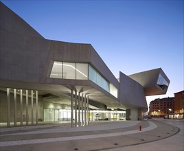 MAXXI – National Museum of the 21st Century Arts, Rome, Italy. Architect: Zaha Hadid Architects, 2009. Dusk exterior.
