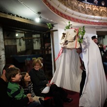 A traditional, welsh 'Mari Lwyd' horses skull being paraded around as people enjoy a Victorian themed Solstice night celebration