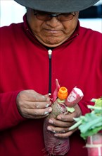 A competitor assembles a figure from radishes for Noche de Rabanos in Oaxaca, Mexico.