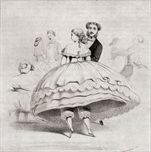 19th century lady wearing a crinoline at a ball.