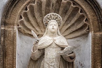 St. Therese of Lisieux statue on the facade of the church and convent of Carmelitane Scalze in the old town of Gallipoli (Le)