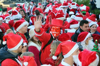 London, UK. 6th December 2014. Participants dressed as Father Christmas in the 2014 London Santacon in the streets of Camden, London which celebrates its 20th anniversdary this year Credit:  Paul Brow...