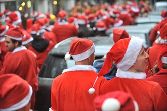 Hoxton, London, UK. 12th December 2015. Santacon London 2015, hundreds of Santas pub crawl