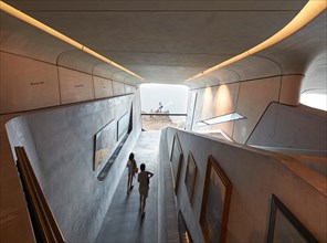 Curved exhibition room with picture window. Messner Mountain Museum Corones, Mount Kronplatz, Italy. Architect: Zaha Hadid Archi