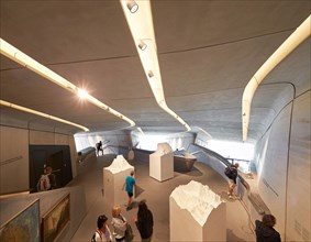 Exhibition space with artefacts. Messner Mountain Museum Corones, Mount Kronplatz, Italy. Architect: Zaha Hadid Architects, 2015