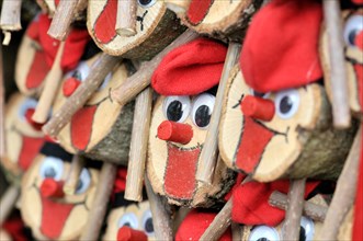 Tions de Nadal (Christmas logs), Catalan tradition, for sale at fair. Fira de Santa Llúcia, Barcelona, Catalonia, Spain