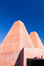 Paula Rego Museum, Cascais, Portugal. Exterior view of the red concrete pyramid-like chimneys.