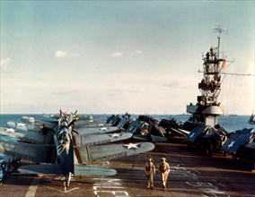 USS Santee (ACV-29)  Douglas SBD-3 Dauntless scout-bombers and Grumman F4F-4 Wildcat fighters on the ship's flight deck during Operation Torch, the November 1942 invasion of North Africa.