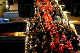 Thousands of revellers dressed as Santa descend on London for Santacon yearly in December. Taken on the Southbank of the river Thames near Waterloo
