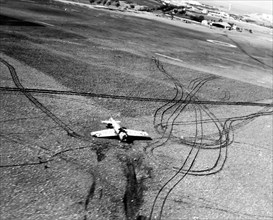 80-G-31436:  Operation Torch, November 1942.  A U.S. Navy fighter F4F on back after nosing into the soft ground at the Safi airport, Morocco, during the U.S. Campaign in North Africa.   Official U.S. ...