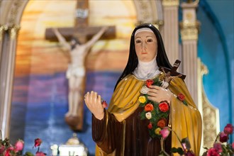 A statue of Saint Therese seen display next to the Shrine of Saint Therese of the Child Jesus in New Port City in Pasay, Metro Manila. The reliquary containing the bones of Saint Therese has been on a...