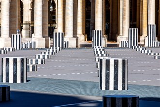 Paris, France - May 29, 2020: Cour d'Honneur in Palais Royal (Palais-Cardinal, 1639) in Paris: Famous Black and white Columns Buren (1985)