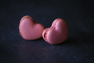 heart-shaped macaroons on dark background. Macaroons Heart. Valentine's Day.