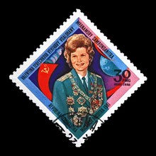Valentina Tereshkova, soviet astronaut, 1st woman in the space, red soviet flag, circa 1981. canceled postal stamp printed in Madagascar isolated on