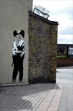 Banksy Kissing Policemen with empty pavement (now removed)