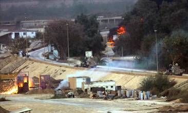 Iraq War April 2003 The opening shots in The Battle for the Republican Palace fall short into the grounds of the Palace in Baghdad Our Picture Shows American armoured vehicles firing on Iraqi position...