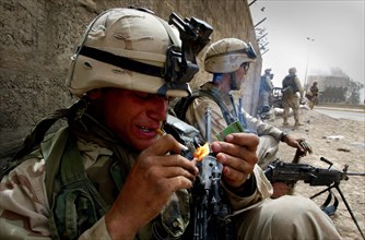 Iraq War April 2003 Baghdad American marines take postions in Eastern Baghdad as they liberate the city Our Picture Shows GI takes a smoke as he enters the city