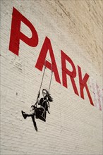 A piece of urban graffiti art by Banksy in downtown Los Angeles