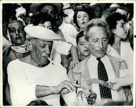 Aug. 08, 1955 - Picasso At Bullfight: Photo Shows The famous artist Picasso wearing cap, signs autographs, when he was a spectators at the bull fight he organized at Vallauris, near Cannes, South of F...
