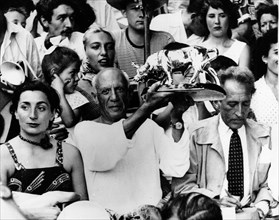 Artist Pablo Picasso with his wife Jacqueline Roque and Jean Cocteau at a bullfight at Vallauris