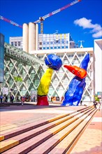 "Personnages Fantastiques" is a colourful outdoor artwork and represent two dancers playing together amongst the high-rises at La Defense,Paris,