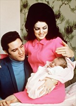 Elvis Presley, Priscilla Presley,  leaving the Baptist Hospital, Memphis, Tennessee, with their daughter Lisa-Marie, born at the hospital on February 1, 1968.   File Reference # 33635_703CPC