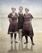 Three beach goers posing in the latest fashion, circa 1915. Image from 4.5 x 2.75 inch nitrate negative.
