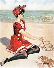 1910s WOMAN SITTING ON BEACH DRAWING DOUBLE HEARTS IN SAND WEARING FASHIONABLE RED BATHING COSTUME ILLUSTRATION BY THE KINNEYS - kr132314 NAW001 HARS DOUBLE JOY LIFESTYLE OCEAN FEMALES COPY SPACE FULL...