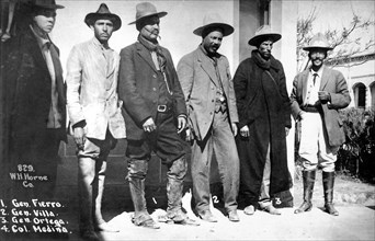 PANCHO VILLA (1878-1923) Mexican revolutionary general third from right with some of his army officers about 1913 - see below