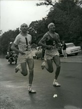 Jun. 26, 1966 - Alain Mimoun, who won the Paris's 10,000 meter race a week ago, surprised us again by winning the Marathon in front of Combes at the age of 46. Combes and Mimoun are pictured running t...