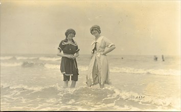 Photograph postcard of two girls in bathing costumes circa 1910