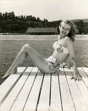 A model presents a two-piece swimsuit from the 1940s